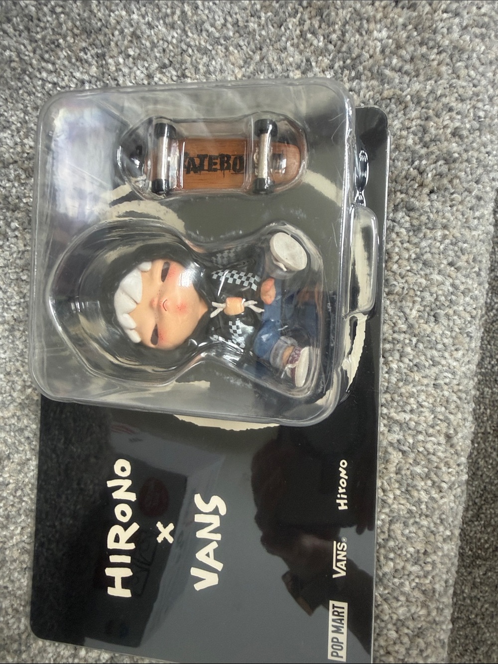 Vans Black Hoodie Collectible Figure with Brown Skateboard